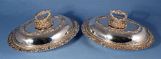 A pair of ornate Victorian oval silver plated entrée dishes with covers, length 278mm.